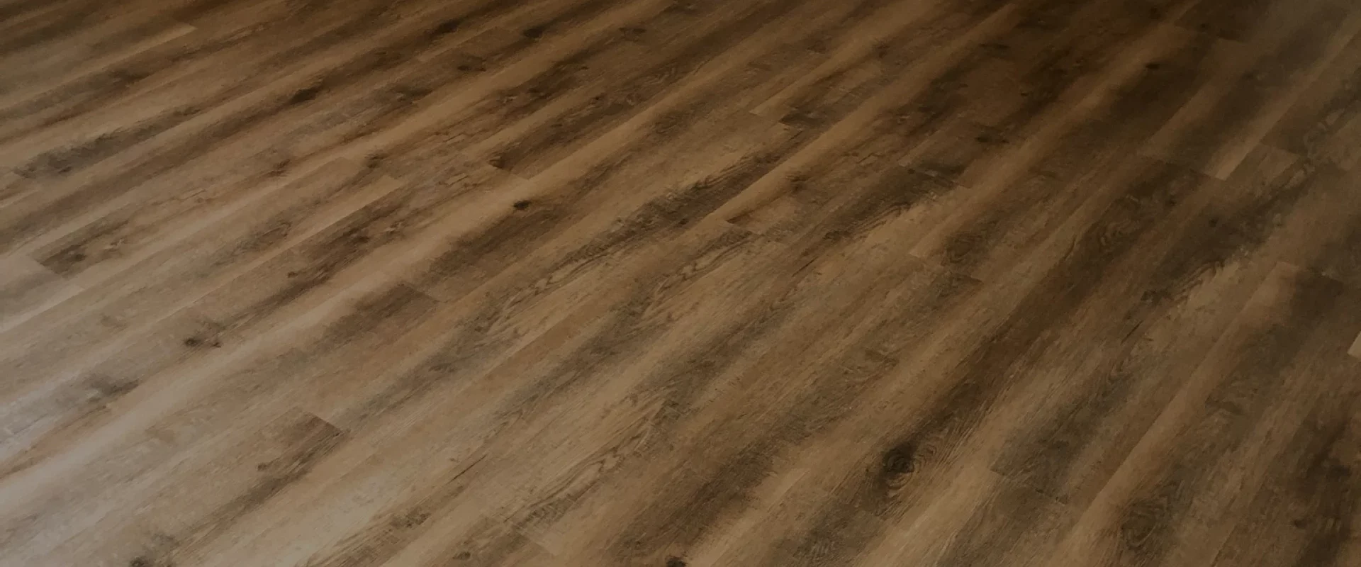 a detailed close up of luxury vinyl plank flooring after flooring installation service bangor wi